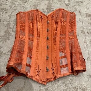 Vibrant orange corset with see through lace corset